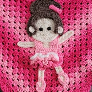 Handmade crocheted granny square baby blanket with ballerina.